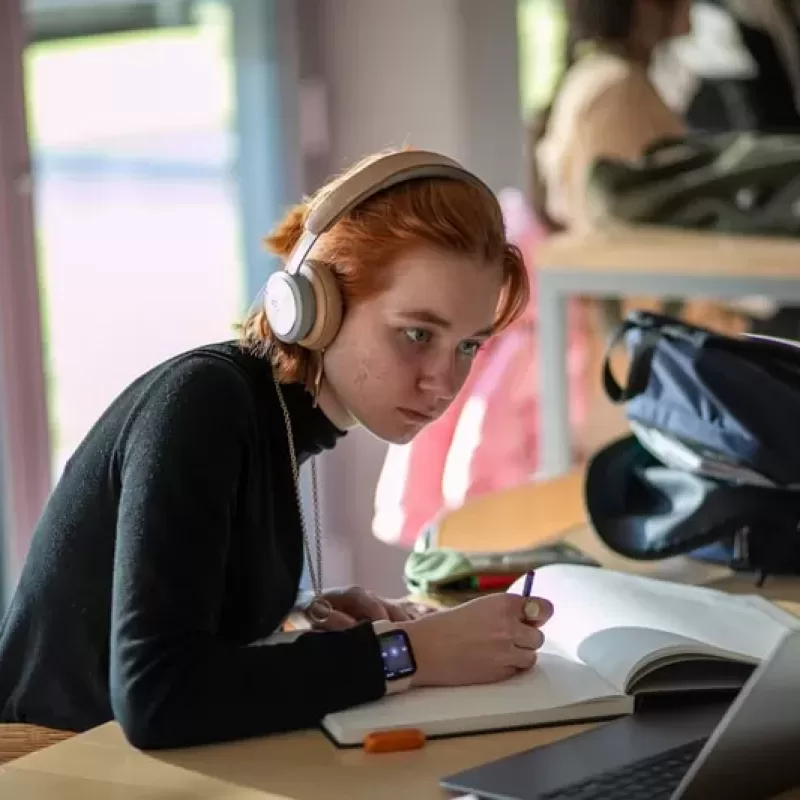 Student concentrates on her schoolwork