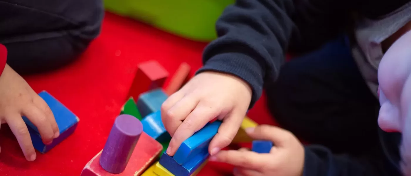 Students play with blocks in class